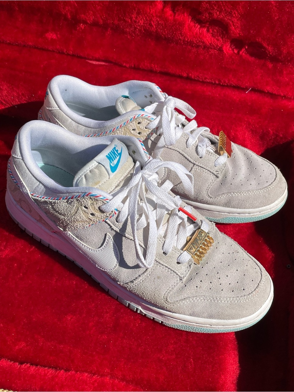 Nike Women's Low-Top Suede Sneakers in Light Gray with Blue Accents